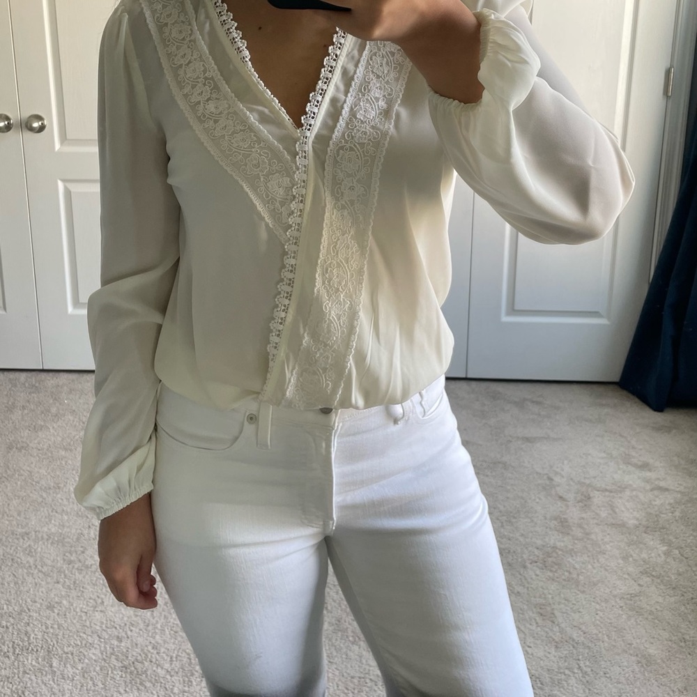 Francesca’s long sleeve ivory wrap blouse